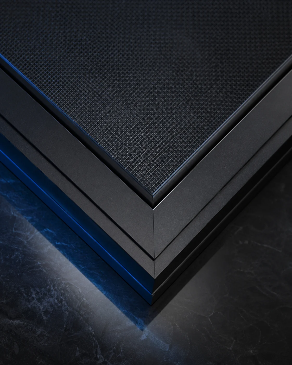 Close-up of fresh black mesh fitted into a black aluminum screen frame